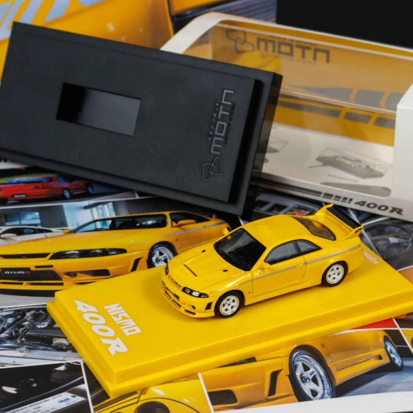 Kyosho 1:64 Mini Car & Book Nissan Nismo 400R Yellow